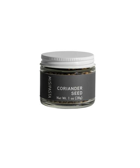 Jar of coriander seed on a white background