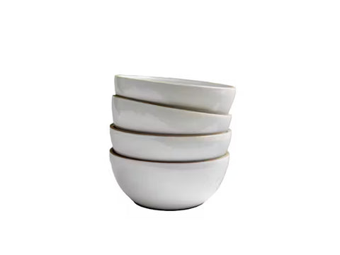Stack of white ceramic bowls on a white background
