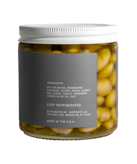 Jar of pickled vegetables with a label on a white background